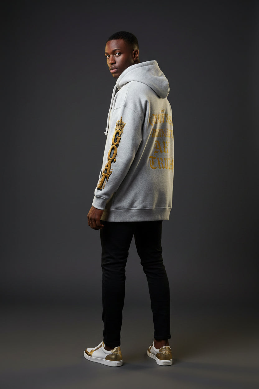 Oversized fleece hoodie in light gray, full body side view with sleeve graphic