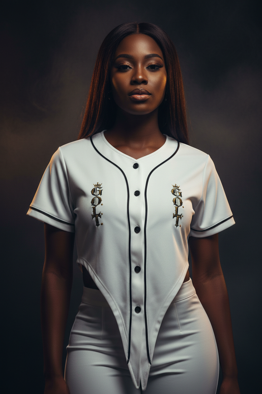 White cropped baseball jersey on model with black piping and chest crest graphic, short sleeves.